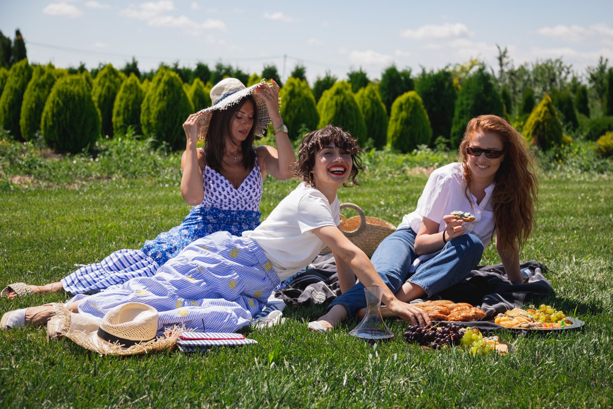 A fashionable summer picnic with a boat